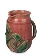 JOHN CAMPBELL pink glazed pottery jug with applied gumnuts and leaves and branch handle, incised "John Campbell, Tasmania", 1948", 19cm high x 16cm wide