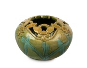 FLORA LANDELLS donkey orchid pottery vase with green glaze, incised "DONKEY ORCHID, LANDELLS, PERTH", 6cm high, 10cm wide.