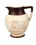 An antique English sprigged pottery jug with brown finished trim, titled "CASTELLMAE", circa 1820, 15cm high