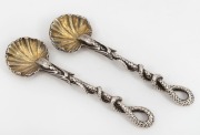 A pair of Georgian sterling silver salt spoons with gilt washed shell bowls and snake handles, circa 1833, 10.5cm long, 61 grams total