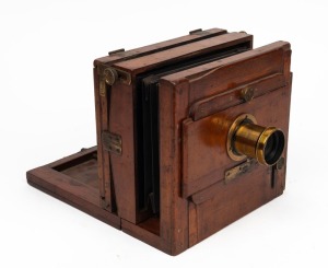 4¾ x 6½" plate tailboard camera with lens with f8/11/16/22/32/44/64 aperture markings.