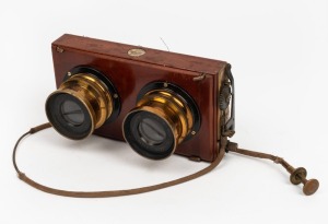 THORNTON-PICKARD: Twin Beck Symmetrical lenses mounted on Thornton-Pickard stereo roller-blind shutter (likely for Royal Ruby camera), with Watson Bowden 'The Antinuous' shutter release cable.