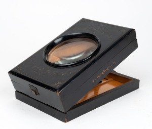 22 x 14 x 6cm folding graphoscope with magnifier lens, photograph holder, and carved floral decorative pattern.