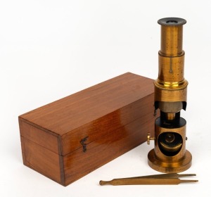 Drum-style 19th century brass microscope, 19cm at highest setting, in wooden box.