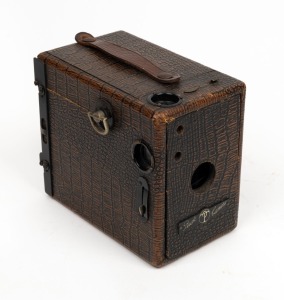 THORNTON-PICKARD: 'Puck' 6 x 9cm rollfilm box camera, c. 1909, with imitation crocodile leather covering.