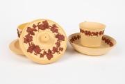 WEDGWOOD unglazed "Caneware" antique English pottery lidded pot with teacup and saucer, decorated in terracotta trailing grape motif, circa 1840, (3 items), impressed "WEDGWOOD", the saucer 14cm diameter - 2