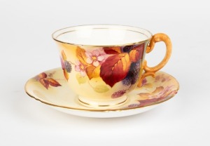 ROYAL WORCESTER English porcelain teacup and saucer with hand-painted berries and blossoms, signed "K. BLAKE", puce factory mark to base, the saucer 14.5cm wide