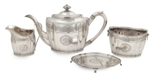 An antique Scottish sterling silver tea service with engraved decoration, comprising of a teapot, milk jug, sugar basin and trivet, made in Edinburgh, circa 1800, (4 items), the teapot 16cm high, 31cm wide, 1270 grams total