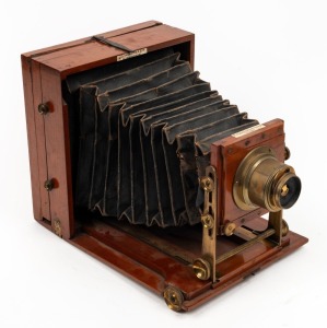 LANCASTER: 'Folding Instantograph' 4¾ x 6½" plate field camera, c. 1890s, with lens with four aperture settings and unusual rear hinge mechanism.