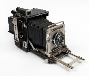 GRAFLEX: Speed Graphic folding 3¼ x 4¼" plate camera, c. 1930, with Optar 135mm f4.7 lens [#884480] and Kalart Synchronized Range Finder attachment [#B90882].