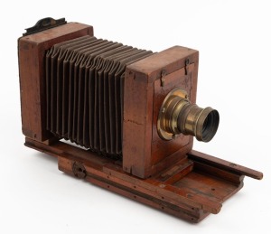 65 x 105mm plate tailboard camera with lens with f8/11/16/22/32/44/64 aperture markings.