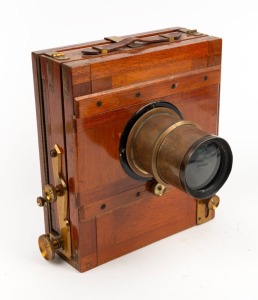 5 x 7" plate tailboard camera with lens with f8/11.3/16/23/32/45/64 aperture markings.