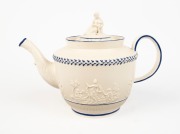 An antique English sprigged pottery teapot with figural finial and blue trim, circa 1790, 17.5cm high, 26.5cm wide