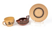 WEDGWOOD antique brown and black Jasper Ware Egyptian Revival cream jug, together with a Cane Ware cup and saucer stamped "STONE", 19th century, (3 items), the jug 12.5cm wide - 2