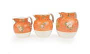 WEDGWOOD graduated set of three antique English pottery jugs decorated in the Chinese style, 19th century, impressed "2 Quart", "3 Quart" and "3 Pint", 19cm high