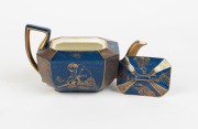 WEDGWOOD blue lustre ware teapot with gilt highlights adorned with Oriental figures, circa 1920s, factory mark to base "WEDGWOOD, ENGLAND" with amphora mark, additional retailer's mark "Manufactured for James Powell & Sons...", 9.5cm high, 17.5cm wide - 2