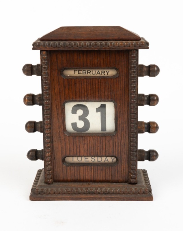 An antique oak desk calendar, early 20th century, ​​​​​​​17cm high