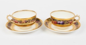 ROYAL WORCESTER two antique English porcelain teacups and saucers adorned with hand-painted fruit decoration, signed "F. ROBERTS", (4 items), puce factory mark to bases, the saucers 12.5cm diameter