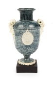 An antique English porcelain urn with face mask handles and classical vignette, circa 1780, bearing "Laver Collection" label to the base, 21cm high overall