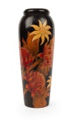 An antique Australian poker work vase with waratahs and flannel flower, 31cm high