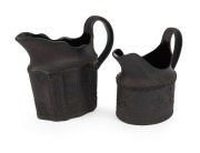 Two antique English black basalt pottery jugs with Etruscan decoration, early 19th century, 11cm and 10cm high