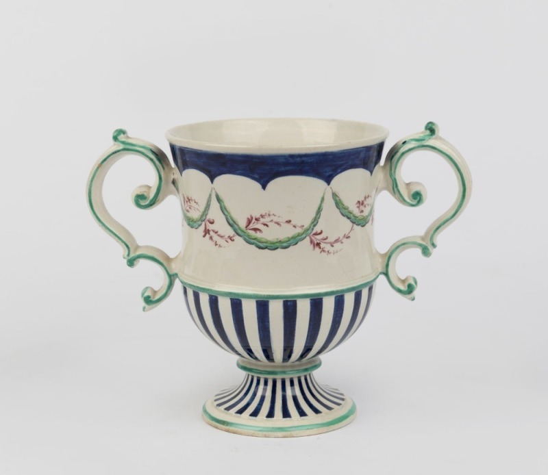 WEDGWOOD pearlware two handled trophy cup shape vase with hand-painted swags and blue decoration, circa 1800, impressed "WEDGWOOD", 14cm high