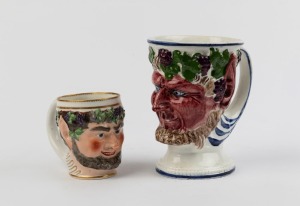 Two antique English and Scottish porcelain Bacchanalian mask head mugs, 18th and 19th century, the smaller with crown mark for Derby, 9.5cm and 16cm high