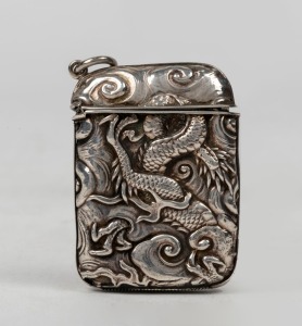 An antique Chinese export silver vesta with repousse dragon decoration, 19th/20th century, 5.5cm high