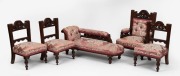 An antique English apprentice miniature salon suite, walnut frames with jacquard upholstery, comprising of a chaise lounge, gent's chair and three single chairs, late 19th century, (5 items), the chaise lounge 51cm long