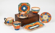 Nine pieces of English Art Deco porcelain tea and table ware in the Clarice Cliff style, various makers, the tray 27cm wide