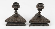 A pair of antique French bronze "Green Man" tri form candlesticks, 19th century, 15cm high