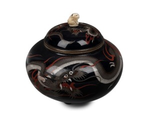 An antique Japanese cloisonne lidded pot decorated with dragon motif on black ground, with later carved ivory finial, Meiji Period, 10cm high
