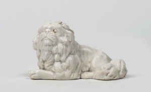 An antique bisque porcelain dog statue, 19th century, 11cm long