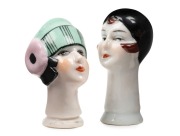 Two Art Deco porcelain&nbsp;cosey doll heads, circa 1925, 6.5cm and 7cm high
