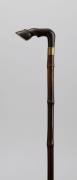 An antique walking stick with carved horn horse hoof handle, brass collar, bamboo shaft and steel ferrule, 19th century, 87cm high - 2