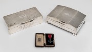 Two antique sterling silver presentation cigarette boxes, together with a miniature medalet C.B.E. (Commander Of The Order Of The British Empire), all dedicated to The Honourable R.T.B. WYNN C.B.E, (3 items), the two boxes 1000 grams total (including ceda