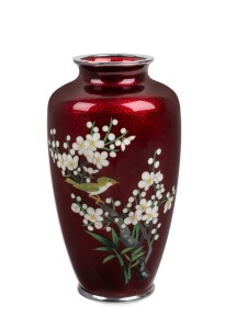 A Japanese pigeon blood cloisonne vase with bird and blossom decoration, Meiji period, 20th century, 18cm high