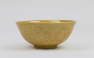 A Chinese yellow lustre glazed bowl with incised dragon decoration, 20th century, 6cm high, 14cm diameter