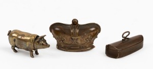 Three assorted novelty vestas comprising a pig, violin case, and a crown, 19th/20th century, the violin case 5cm high