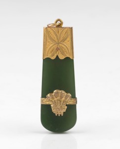 An antique New Zealand greenstone and 9ct gold pendant with Prince of Wales feather plume and engraved decoration, 19th century, 6cm high