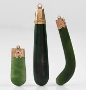 Three antique New Zealand greenstone and engraved 9ct gold pendants, 19th century, ​​​​​​​the largest 7cm high