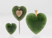 An antique New Zealand greenstone and 9ct gold heart shaped stickpin; together with two heart shaped pendants, 19th/20th century, (3 items), the stickpin 6cm high overall