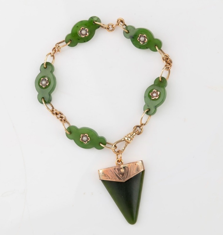 An antique New Zealand greenstone triangular fob pendant mounted in 9ct gold, suspended on a greenstone and gold fob chain with seed pearl decoration, 19th century, 23cm overall