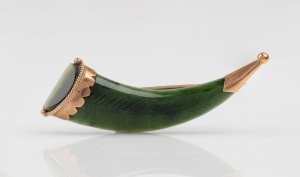 An antique New Zealand greenstone cornucopia brooch with engraved fern leaf decoration, mounted in 9ct gold, 19th century, 5cm long
