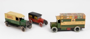 Three vintage tinplate toy delivery vases including a French example, ​​​​​​​the largest 25cm long