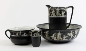 GRIMWADES antique English porcelain four piece wash set with classical frieze on black ground, comprising of a wash jug, basin, chamber and brush pots, early 20th century, (4 items), black factory mark to bases, the jug 32cm high