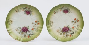 A pair of antique Austrian green porcelain cabinet plates adorned with flannel flowers and waratah, early 20th century, 24cm wide