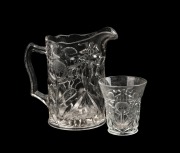 A vintage glass jug and beaker with pressed waratah motif, 20th century, the jug 19cm high