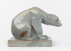 WEDGWOOD English pottery statue of a polar bear by JOHN SKEAPING with Norman Wilson glaze, circa 1960, impressed "J. SKEAPING, WEDGWOOD", with factory marks to base, 17.5cm high, 24cm long. PROVENANCE: Millicent Taplin Collection, head of art department, Wedgwood (1932-1960)