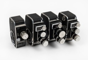 BOLEX-PAILLARD: Four double-8 movie cameras with all lens caps present - one c. 1942 L8 with one lens, one c. 1958 B8L with two lenses, one c. 1958 B8SL with two lenses, and one B-type model also with two lenses. (4 movie cameras)